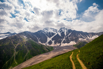 Naklejka premium Picturesque view of the glacier seven with a tourist trail in sunny weather