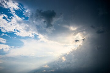 Dramatic stormy sky with rays of sunshine