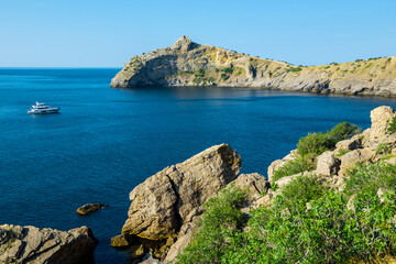Fototapeta premium Picturesque seascape with beautiful view of Cape Kapchik and the Black Sea. Crimean Peninsula. Russia
