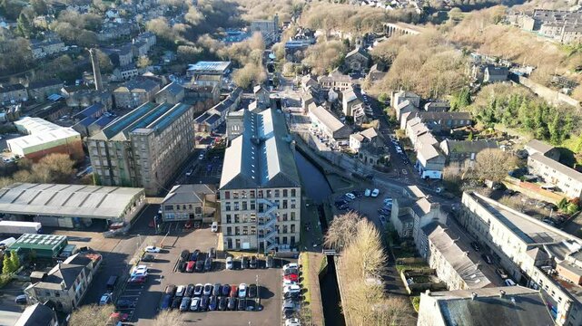 View of Slaithwaite by drone, featuring Spa Mill and Huddersfield Narrow Canal in West Yorkshire