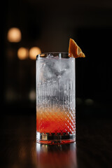 cocktail with ice garnished with orange