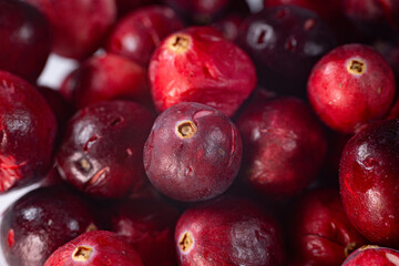 Close-up of freeze-dried cranberries, some whole and others halved, showcasing their vibrant red color and airy texture. Perfect for snacks, baking, or as a healthy topping.