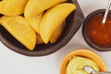 Delicious traditional Colombian empanadas with spicy sauce