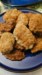 Fried cutlets on a blue ceramic plate