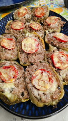Peppers with minced meat baked with cheese.