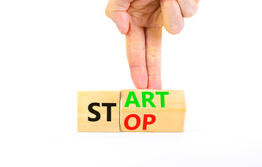 Start or stop symbol. Concept words Start or Stop on beautiful wooden block. Beautiful white table...