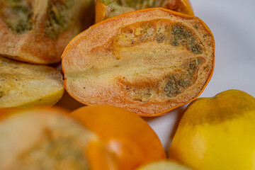 A vibrant collection of freeze-dried tomatoes in a mix of whole and sliced pieces. The rich textures and earthy tones highlight the preservation process.