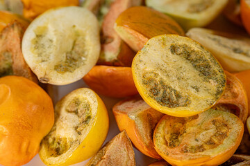 A vibrant collection of freeze-dried tomatoes in a mix of whole and sliced pieces. The rich textures and earthy tones highlight the preservation process.