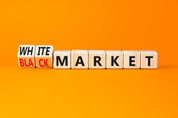 Black or white market symbol. Concept words Black market or White market on beautiful wooden blocks. Beautiful orange table orange background. Business black or white market concept. Copy space.