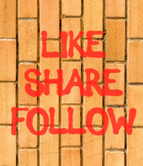 Like share follow symbol. Concept words Like Share Follow on beautiful brown brick wall. Beautiful brown brick wall background. Business like share follow concept. Copy space.