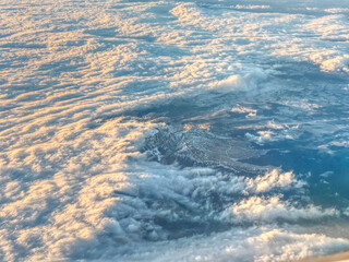 Aerial view of Puy de Sancy surrounded by clouds from passenger plane, Massif Central, France