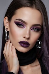Fototapeta premium Beautiful beauty or fashion portrait of a girl with purple makeup purple hair on a solid color background