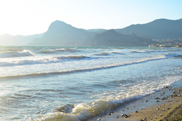 Background landscape view of Sudak Bay, the city of Sudak and its embankment in Crimea