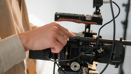 Cameraman hand. Video studio. Unrecognizable male operator adjust professional filming equipment. Modern technology for photo media recording shoot.
