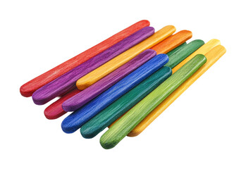 Colorful wooden sticks arranged in a playful pattern for creative activities at a crafting table isolated on transparent background