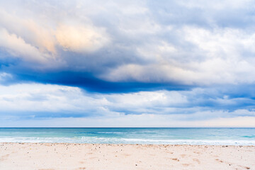 Storm clouds over ocean and beach