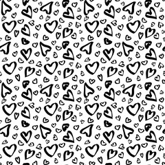 Romantic seamless pattern with black hearts a white background. Suitable for design of postcards, packaging, textiles, Valentine's Day greetings and wedding themes.