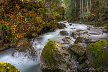 The stream at val di funes in autumn season Dolomites Italy