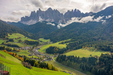 Obraz premium The specular landscape when you drive at Val di Funes area in Autumn season, Dolomite, Italy.
