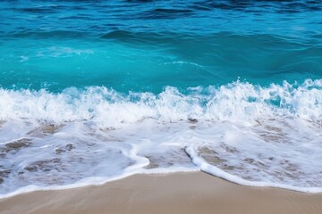 Ocean Waves Gradient: Waves crashing onto the shore with colors transitioning from deep navy blue to turquoise and white foam