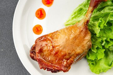 Duck leg confit baked bird meat fresh tasty food dish delicious gourmet food background on the table rustic food top view copy space