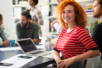 Portrait of young happy success woman working in a busy modern workplace, Startup coworker concept