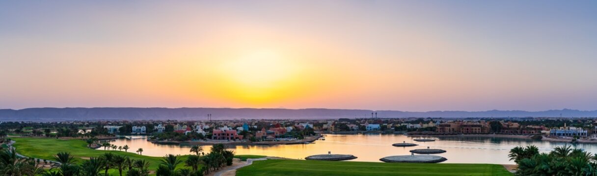 Idyllic Lakeside Golf Course with Vibrant Sunset in Scenic Landscape at El Gouna Red Sea Agypt