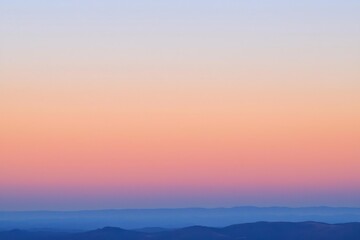 Fototapeta premium Sunset Gradient: A sky transitioning from deep orange to soft pink, with the horizon fading into a calm, dusky blue