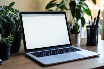 Fototapeta premium A laptop computer sits on top of a wooden desk, perfect for working or studying