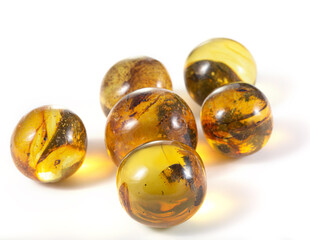 A group of yellow and brown glass beads