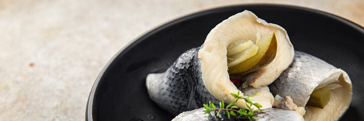 Rollmops herring dish roll onion and pickles appetizer fresh tasty food gourmet food background on the table rustic food top view copy space vegetarian food pescetarian diet