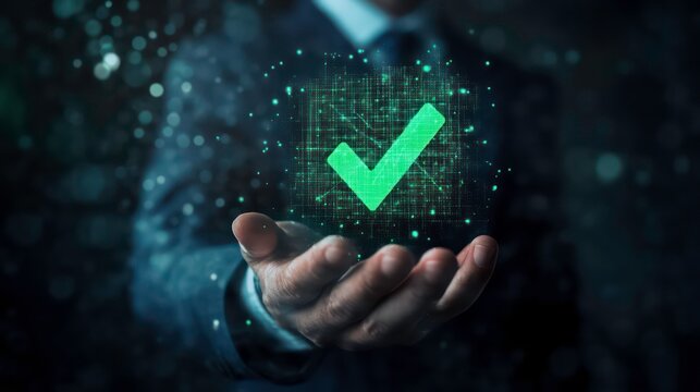 Businessman holding a glowing green checkmark symbol representing success, approval, and digital technology.