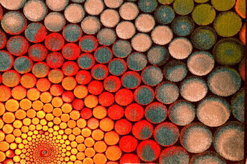 Soft carpet with bright patterns, background. Fluffy rug, interior element, flooring, carpet with geometric round pattern