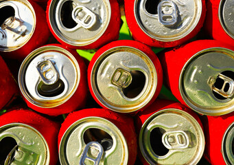 Opened Coke Cans background, texture. Open drink soda cans close up, top view. Open coke can,...