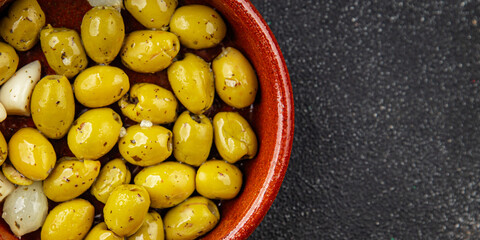 Olives mediterranean with garlic snack aperitif fresh tasty food dish  gourmet food background on...