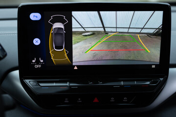 Car display and rear view camera. Parking assistant inside car. Video parking system in modern car....
