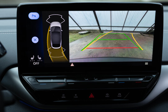 Car display and rear view camera. Parking assistant inside car. Video parking system in modern car. Automotive safety technology equipment. Rear View Monitor for car reverse system