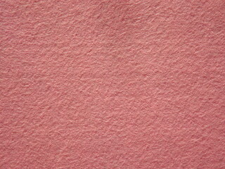 The textured surface is brown, red in color as a background. Felt