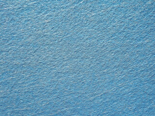 The textured surface is blue as a background. Felt