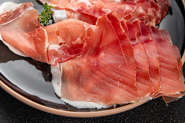 Jamon meat iberico or serrano snack aperitif fresh tasty food dish gourmet food background on the...