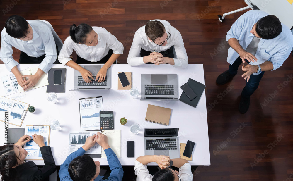 Fototapete Top view analyst team utilizing BI Fintech to analyze financial data at table in meeting room. Analytic BI dashboard power on paper for business insight and strategic marketing planning. Prudent