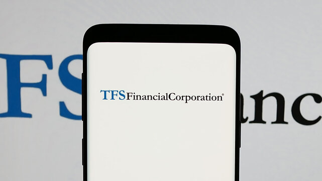 Stuttgart, Germany - 01-15-2025: Mobile phone with logo of US financial company TFS Financial Corporation on screen. Focus on phone display.