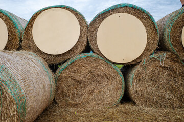 round haystacks with round plywood boards without inscriptions. copy space