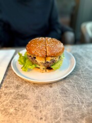 Hamburger cheeseburger served with plate at restaurant