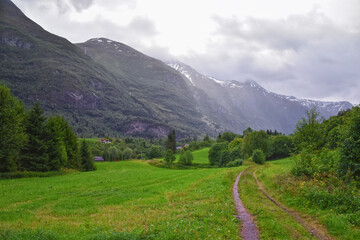 View to Sognefjord Olden in Norway 2024. Small town cruise port Olden Norwegian fjords, Rorbu...