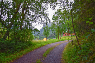 View to Sognefjord Olden in Norway 2024. Small town cruise port Olden Norwegian fjords, Rorbu houses. By Briksdal Glacier. Scandinavia, Europe.