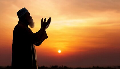 A silhouette of a man praying at sunset, symbolizing spirituality and reflection in a serene, colorful sky.