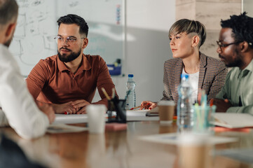 Business people collaborating during meeting in modern office