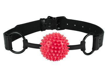 Spiky red ball gag with a black leather strap, isolated on white background. Cut out. Sex toy for domination game.