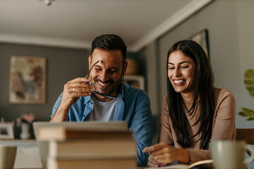 Modern living. Couple balancing their budget in a stylish, airy interior